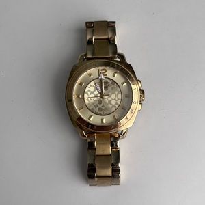 Coach Women’s gold watch, some wear on the band as shown in photo